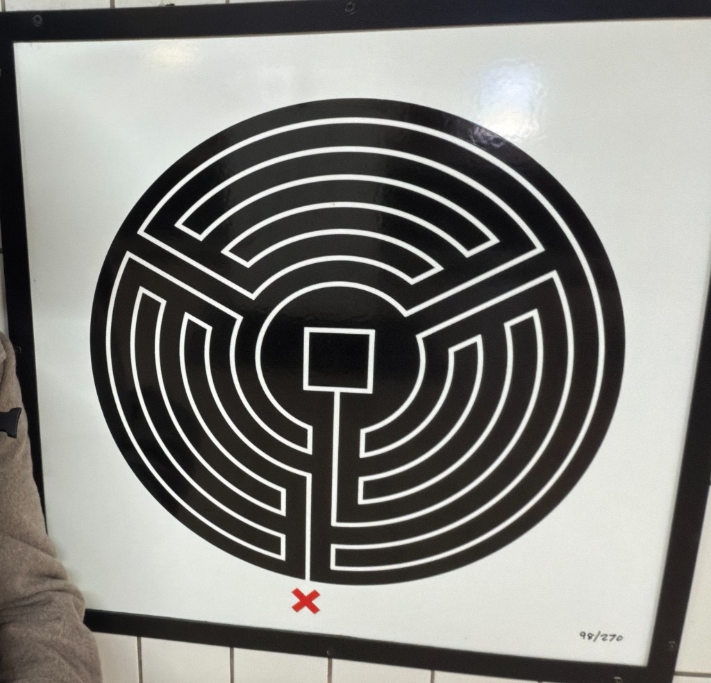 Mark Wallinger labyrinth plaque 98 of 270, mounted on tiled station walls